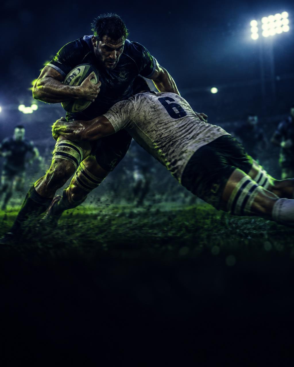 Rugby tackle under floodlights